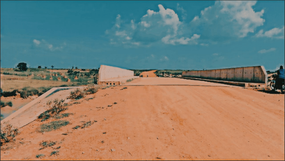 Bridge culvert connecting the village to the dairy facility. Photo Credit: Cole Praise/DUBAWA.