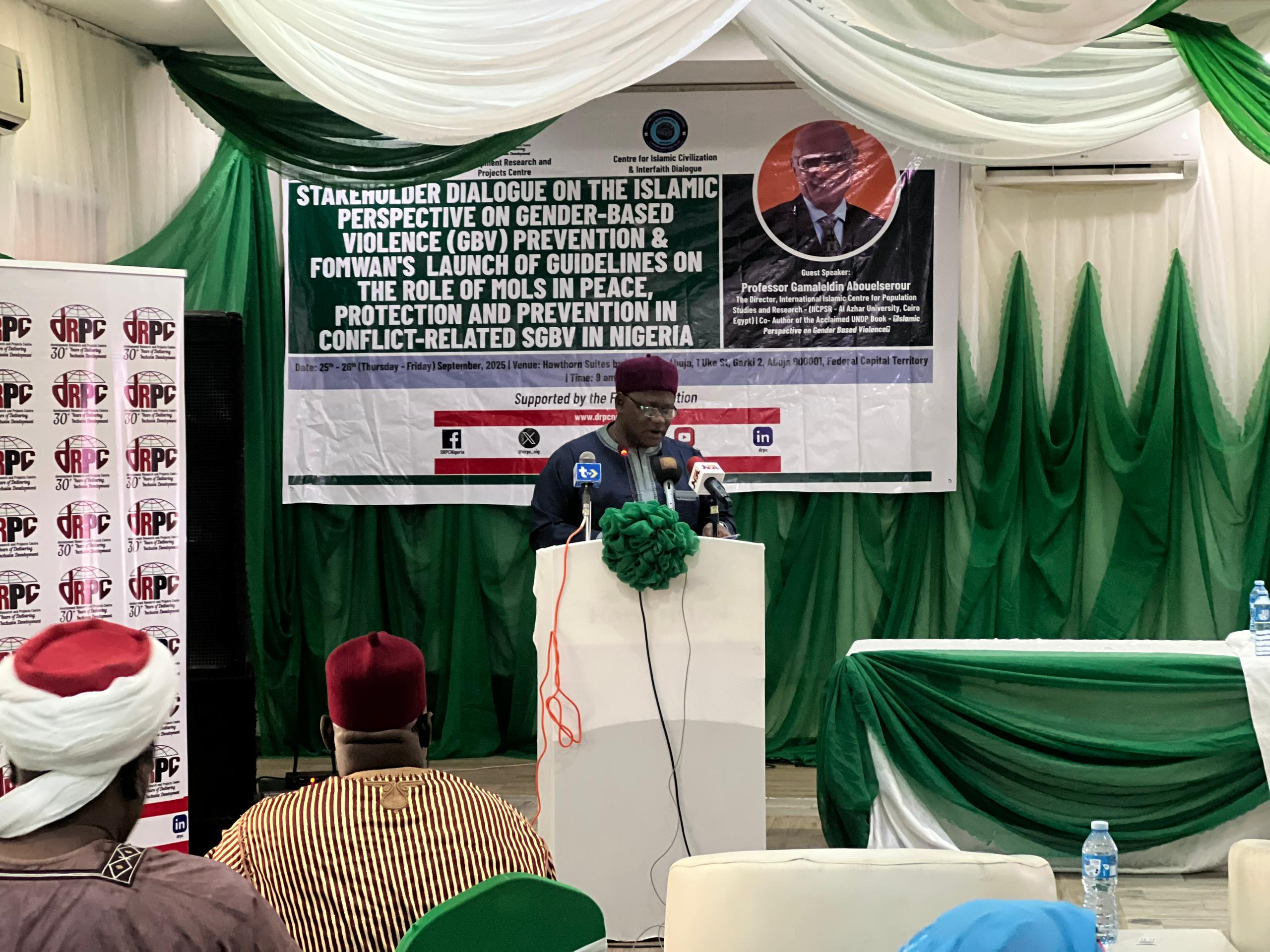 A member of the board of the dRPC, Sani Garko, a professor, takes the podium to deliver the welcome address