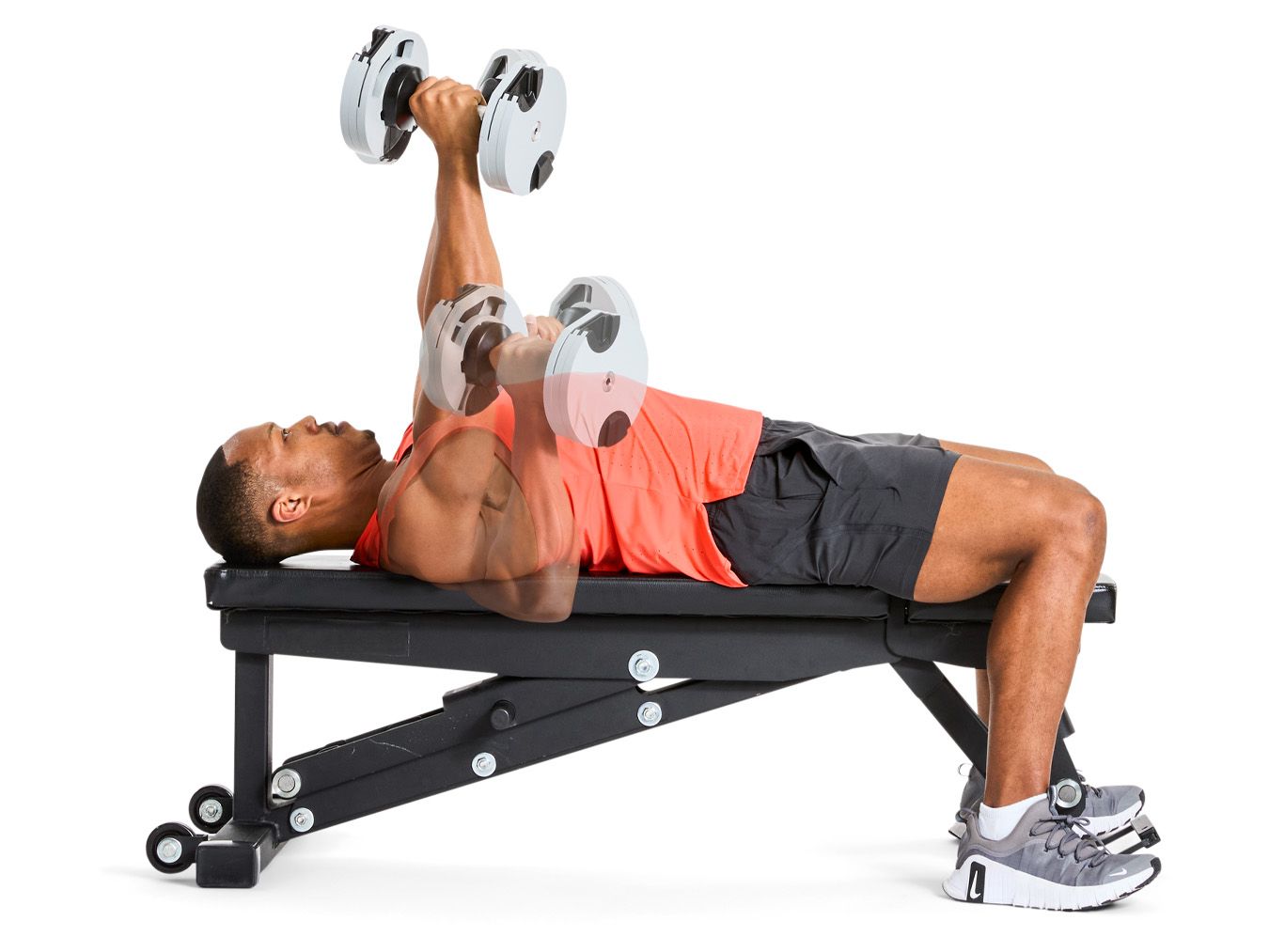 Dumbbell Bench Press.jpg man performing a dumbbell exercise on a bench