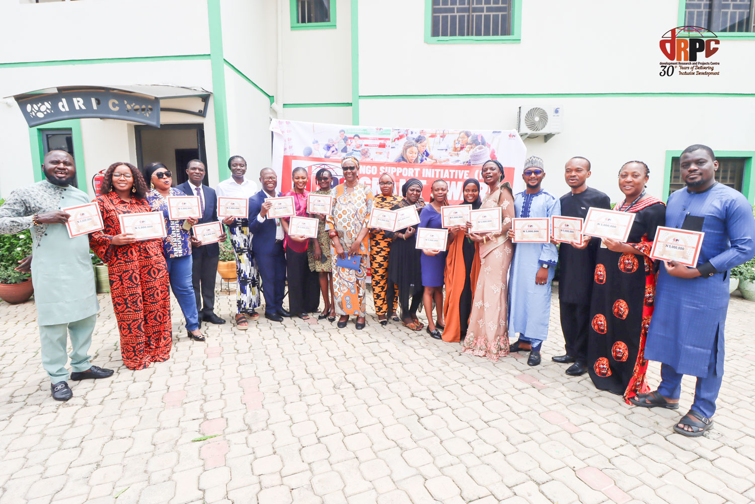 A group picture with all the 17 recipients of the NSI grant during the Handing Over ceremony to the winners at the dRPC office in Abuja