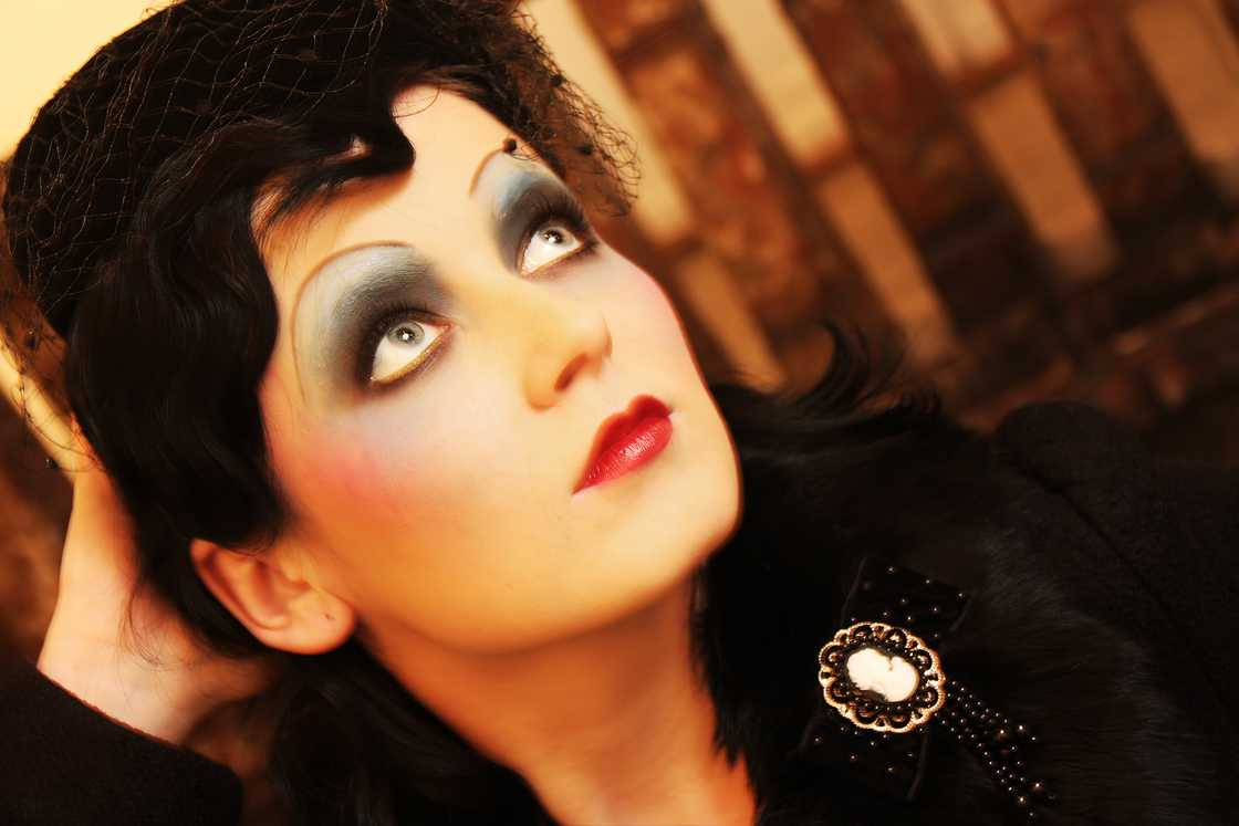 Beautiful woman in twenties glamorous style with a bit of dreamy blurriness