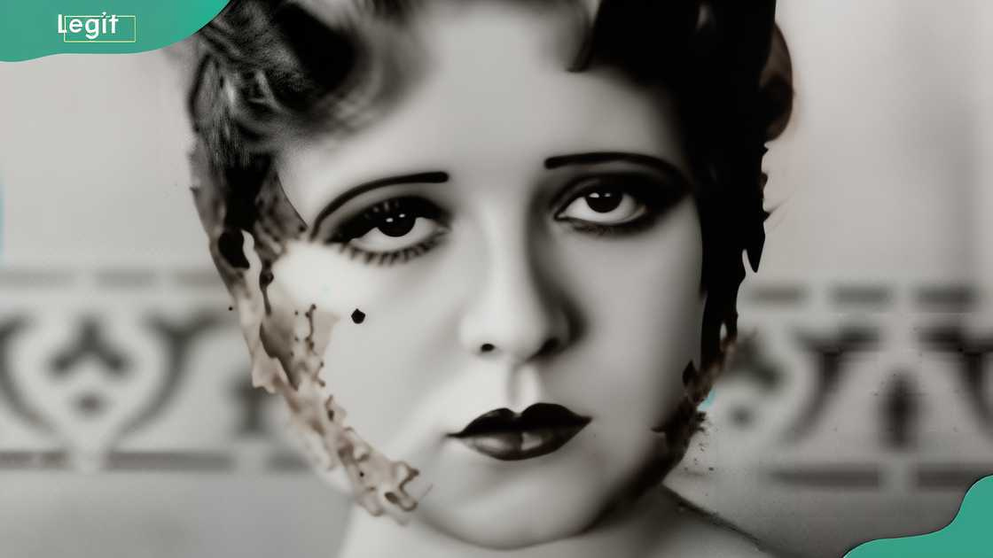 Elegant woman in sleeveless gown posing in studio